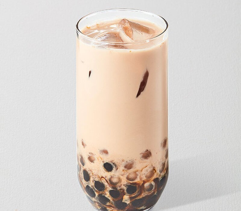 chilled glass of panda milk tea enhances mood 
